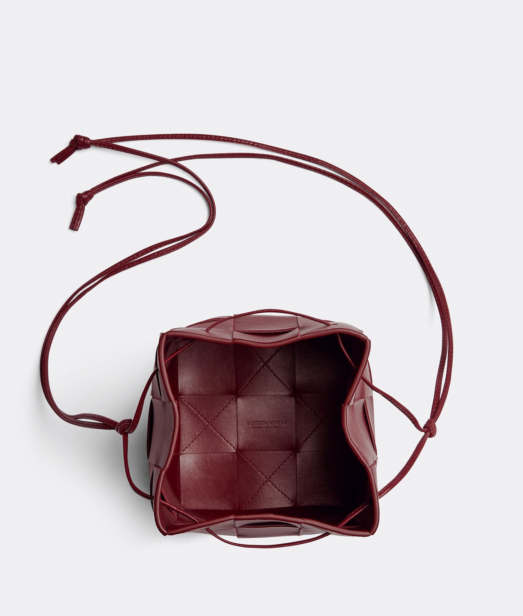 Small Cassette Cross-Body Bucket
“Bordeaux”